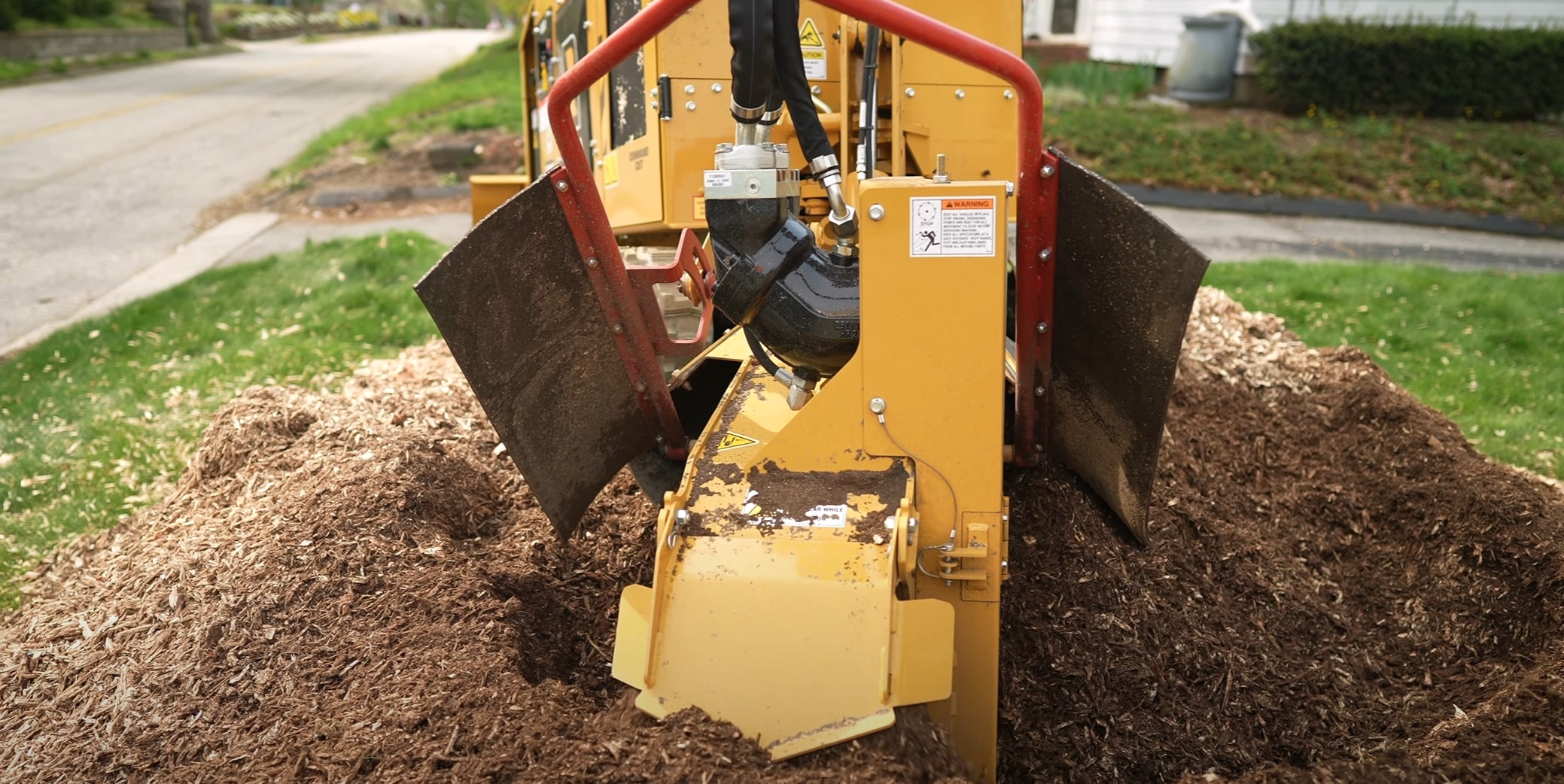 Stump grinding service removing tree stump on residential lawn in Lake Stevens, WA